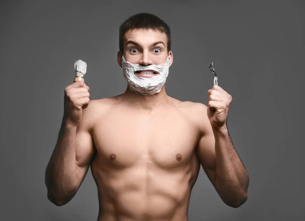 young man with shaving foam - 写真・画像
