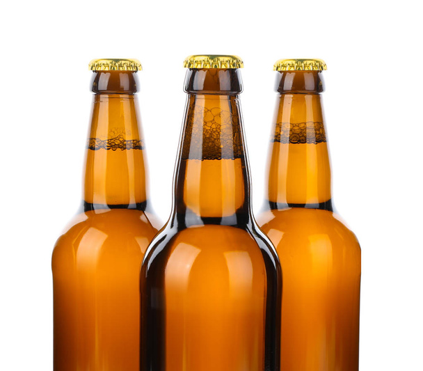 Glass bottles of beer isolated on white - Фото, изображение