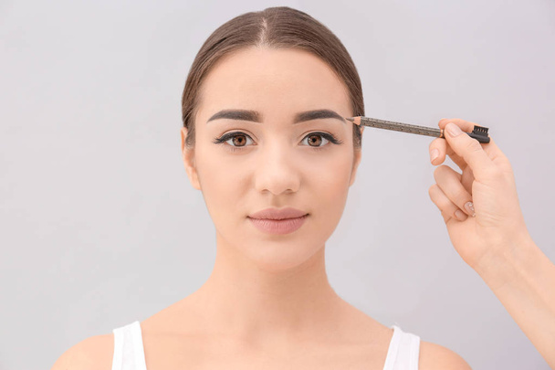 woman undergoing eyebrow correction procedure - Zdjęcie, obraz