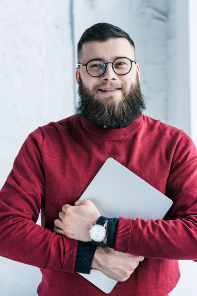 portrait of stylish smiling businessman with laptop - Fotoğraf, Görsel