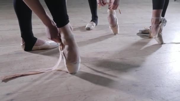 Pointe shoes close up. Young ballerina girls. Women at the rehearsal in black bodysuits. Prepare a theatrical performance - Footage, Video