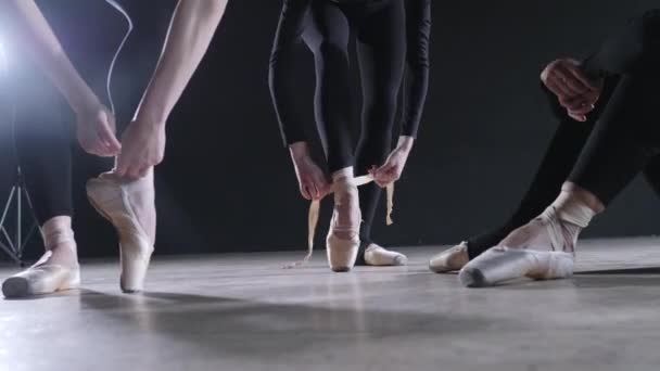 Pointe shoes close up. Young ballerina girls. Women at the rehearsal in black bodysuits. Prepare a theatrical performance - Footage, Video