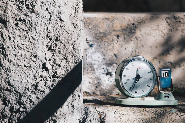 Vintage calendar clock with day of the month and month - concrete, cement texture or background. Copy space. Place for text. graphical resource - 写真・画像