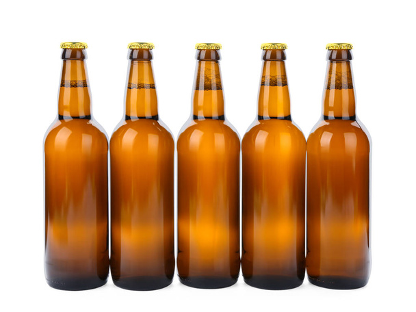 Glass bottles of beer isolated on white - Фото, зображення