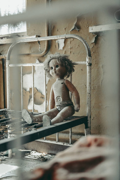 Chernobyl doll. Inside abandoned town of Pripyat left after the Chernobyl Nuclear Disaster. - Фото, зображення