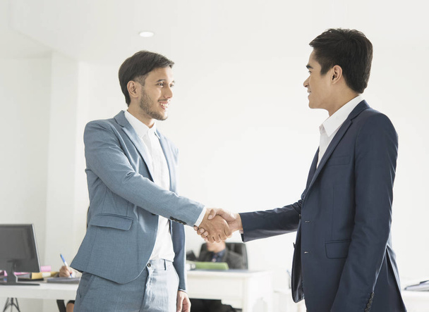 Businessmen making handshake agreement.  - Foto, afbeelding