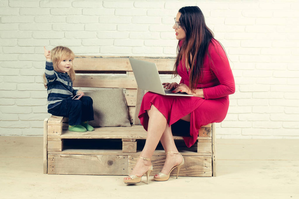 Woman and child with laptop, inclusive education. - Φωτογραφία, εικόνα