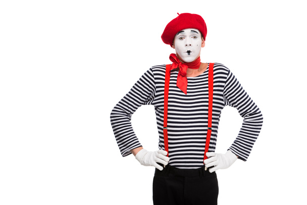 surprised mime standing with hands akimbo isolated on white - Photo, Image