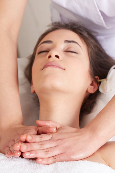 Female Enjoying Relaxing face Massage In Cosmetology Spa Center - Fotó, kép