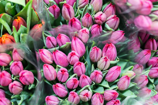 Bunch of many beautiful fresh pink tulips. Wholesale and retail flower store. Flower shop or market. Florist service concept.  Floristy for wedding. Top view - Foto, Imagem