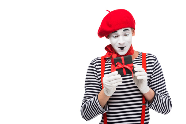 surprised mime looking at present box isolated on white - Photo, Image