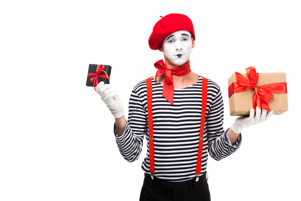 mime holding present boxes and looking at camera isolated on white - Fotografie, Obrázek