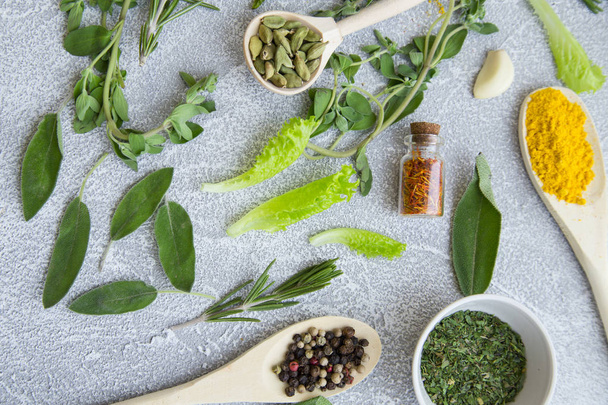 Set of spices and herbs on light stone background - Foto, immagini