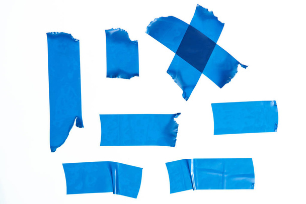 Aantal blauwe masking tape stukken - Foto, afbeelding