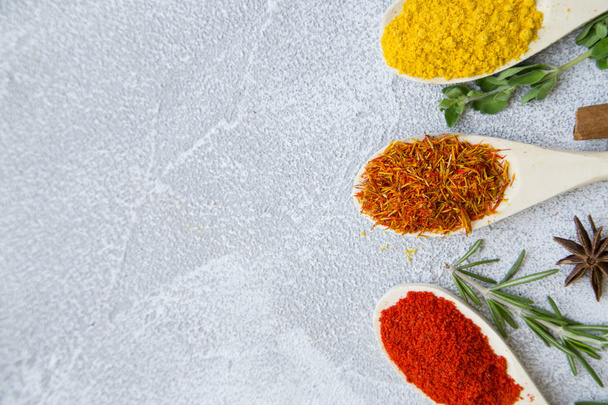 Set of spices and herbs on light stone background - Foto, imagen