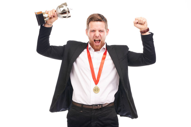 Businessman holding trophy - Photo, Image