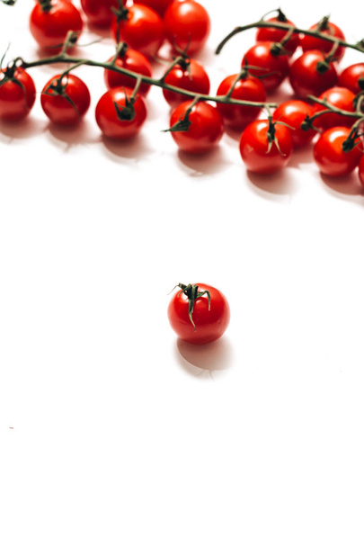 branches of raw ripe cherry tomatoes isolated on white background  - Photo, Image