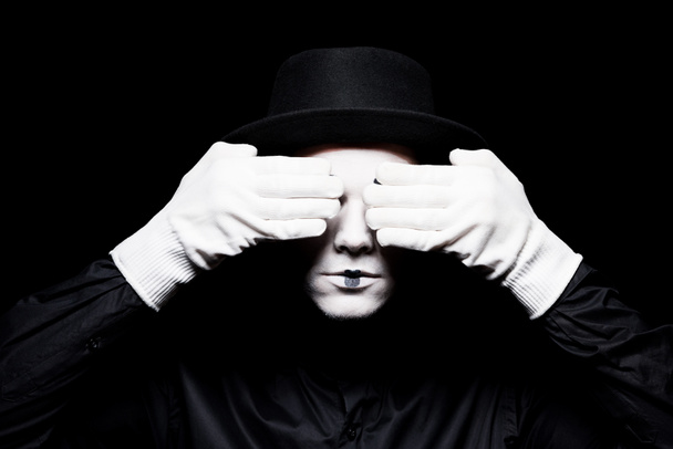 mime covering eyes isolated on black - Photo, Image