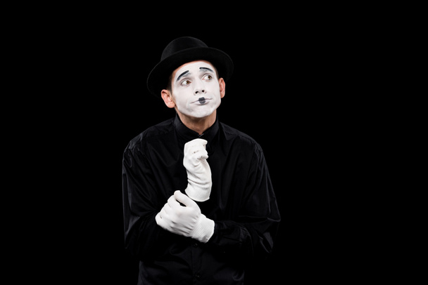 pensive mime looking away isolated on black - Fotografie, Obrázek