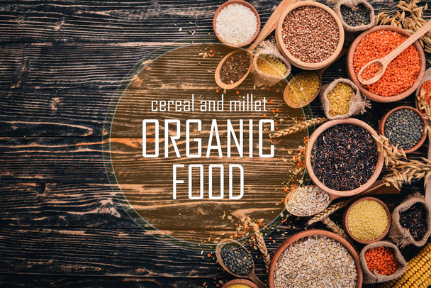 Cereal and millet. Organic food. Buckwheat, lentils, rice, millet, barley, corn, black rice. Top view. - Photo, image
