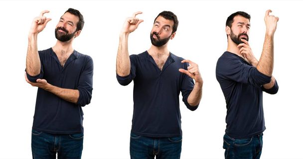 Set of Handsome man with beard making tiny sign - Photo, Image