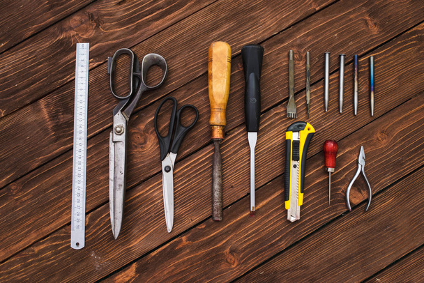 Leather crafting, tools flat lay still life - Foto, Imagen