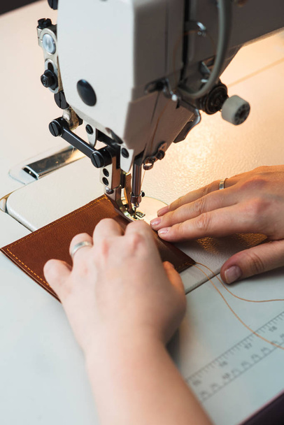 Closeup of sewing machine working part with leather - Valokuva, kuva