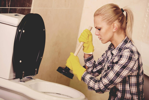 The plumber repairs the pipes. Male specialist plumber repairs. - 写真・画像
