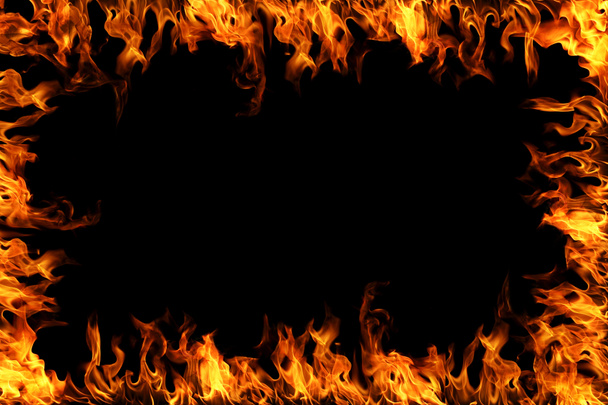 Blazing flames over black background - Photo, Image