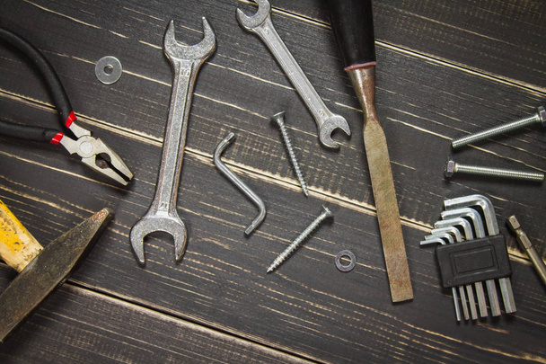 Joinery tools on a dark wooden table. Place for the text. A conc - Photo, image