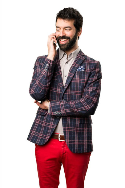 Well dressed man talking to mobile on white background - Φωτογραφία, εικόνα