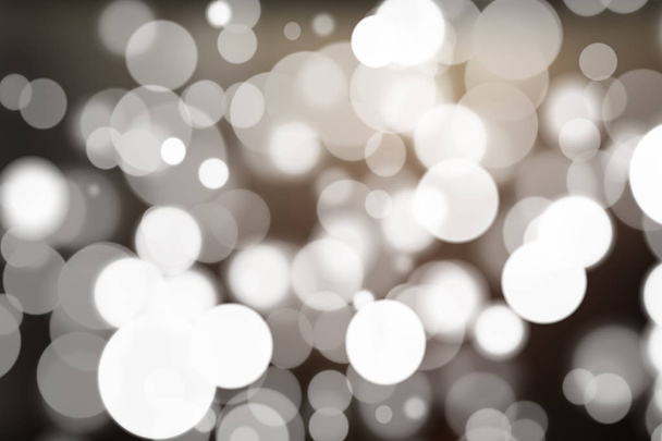 Abstract bokeh festive background with defocused lights - Foto, afbeelding