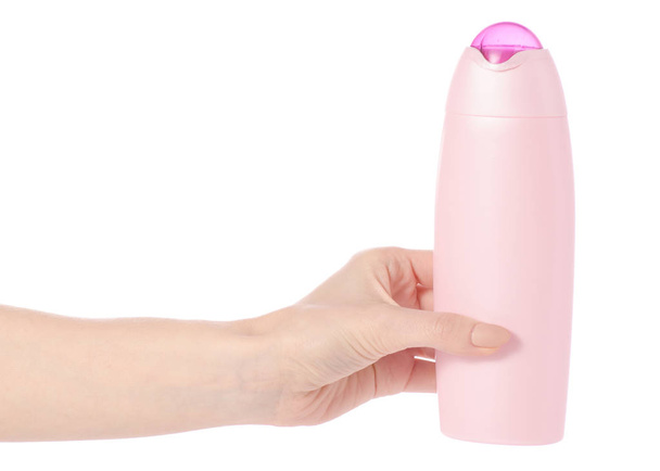 Shower gel in pink plastic bottle in hand - Foto, Imagem