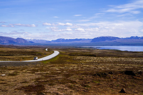 Road and fields, river in the park Thingvellir. Iceland 12.06,2017 - Photo, Image