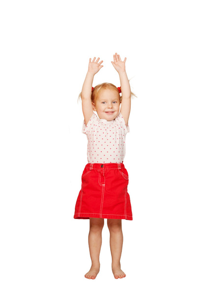 Happy child lifting up her hands. - Valokuva, kuva