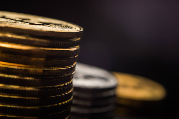 Macro view of shiny coins with Bitcoin symbol on dark background - Zdjęcie, obraz