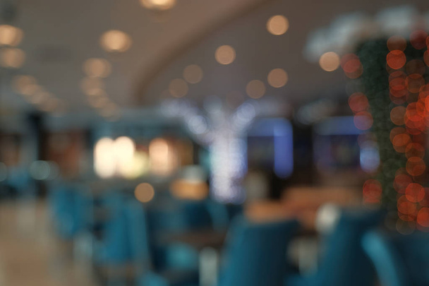 Abstrakti hämärtää ravintolan sisustus tausta. Suhahdus kahvila tai kahvila ravintola abstrakti bokeh kevyt kuva tausta
 - Valokuva, kuva