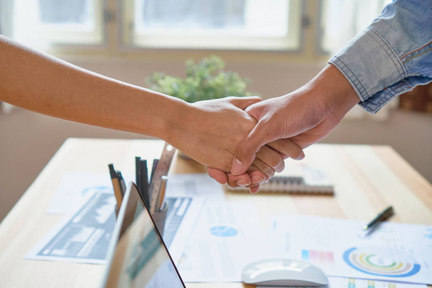 Joint Hands of Two Businessmen After Negotiating a Successful Business Agreement, And the handshake together. This is to promote cooperation in the joint business. Teamwork planning - Photo, Image