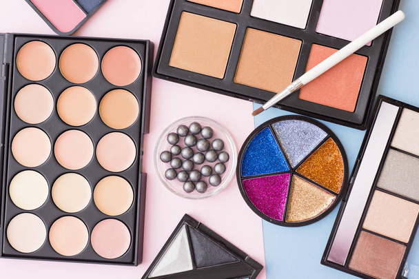 Cosmetic products on pastel colors background - Valokuva, kuva