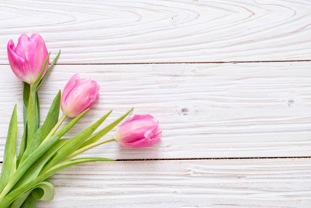 pink tulip flower on wood background - Fotografie, Obrázek