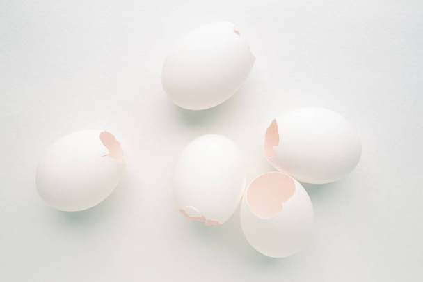 Creative pastel background with white eggshells on white backgro - Photo, Image