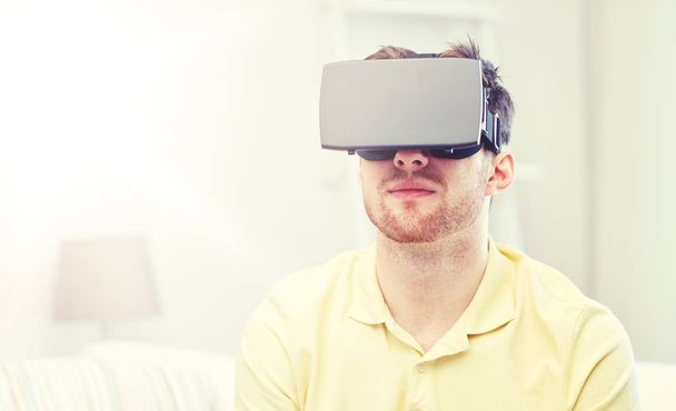 young man in virtual reality headset or 3d glasses - Fotografie, Obrázek