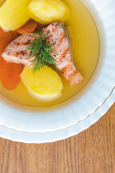 top view of delicious healthy salmon soup on wooden tabletop  - Foto, imagen