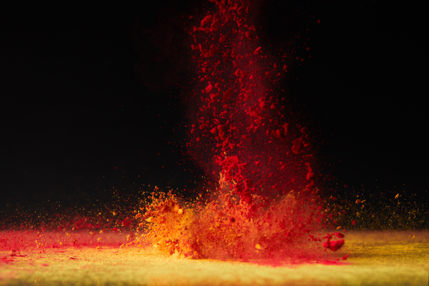 orange holi powder explosion on black, Hindu spring festival - Photo, Image