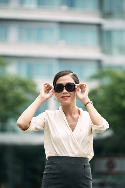 Portrait of beautiful business lady wearing sunglasses - Фото, зображення