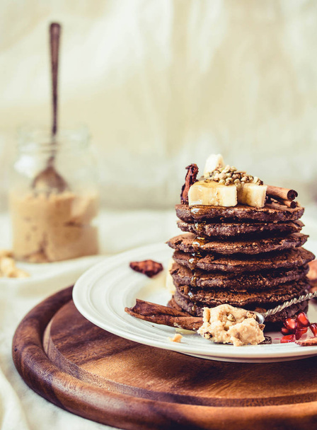 Chocolate pancakes with banana, peanut butter, green buckwheat a - Fotografie, Obrázek