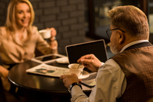 selective focus of business people having meeting in cafe - Фото, зображення