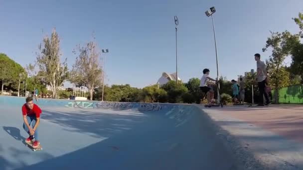 Kid Falling Off a Skateboard in Skatepark Bowl Slow Motion - Кадры, видео