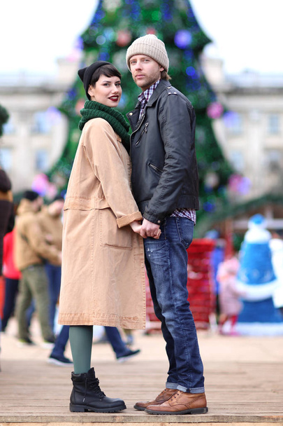 Cute young couple in warm clothes outdoors - Photo, Image