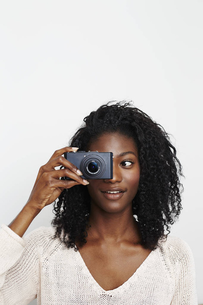 Young african girl with photo camera on white background - Foto, Imagem